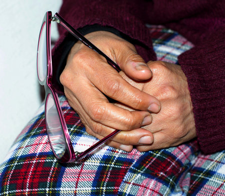 the hands of a sitting ladyの写真素材
