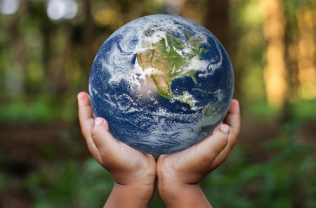 the planet earth in the hands of a child, celebrating earth day
