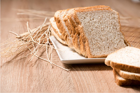 bread in plate on wood table