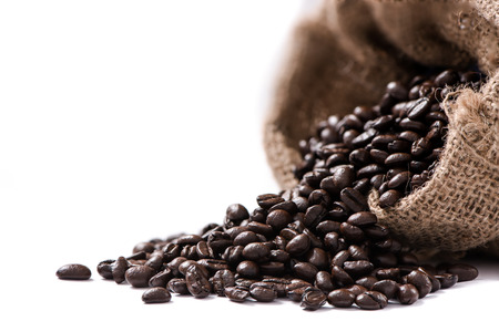 coffee beans in sack on white backgroundの写真素材