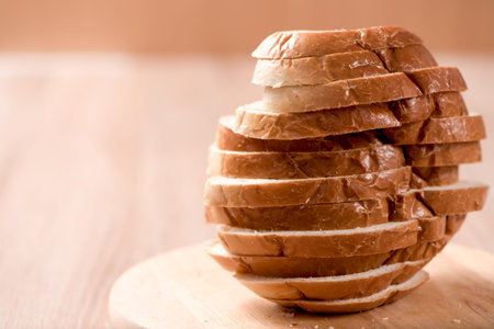 bread on chopping block in wood background