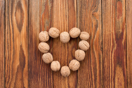 The walnuts on the old wood background