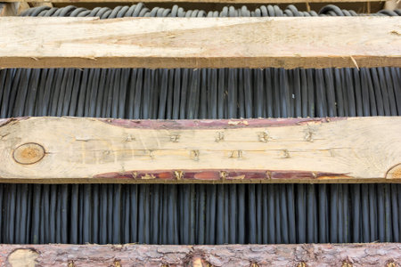 black electric wire in a wooden packing