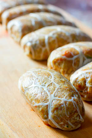 cutlets from minced meat on a wooden cutting board closeup, selective focusの写真素材