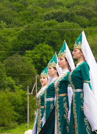 Adygea, RUSSIA - JULY 25 2015: Young girls in Adyghe national costumes dancing traditional dance at...