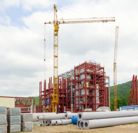 lifting cranes on construction enterprises of steel trussesの写真素材