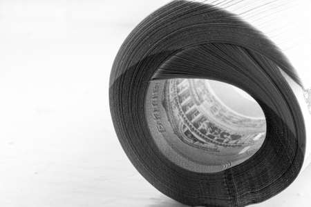 Russian national currency. stack of new paper money rolled into a roll close-up. shallow depth of field. black and white photoの写真素材
