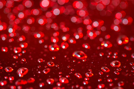 abstract red background of shiny blurry rain dropsの写真素材