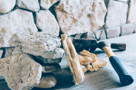 Construction Hammer And Stack Flagstone Against The Wall Of Stone Closeup. Concept Building, Repairの写真素材
