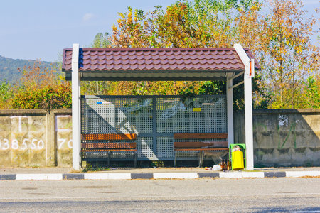 A Bus Stop Without People With Scattered Garbageのeditorial素材