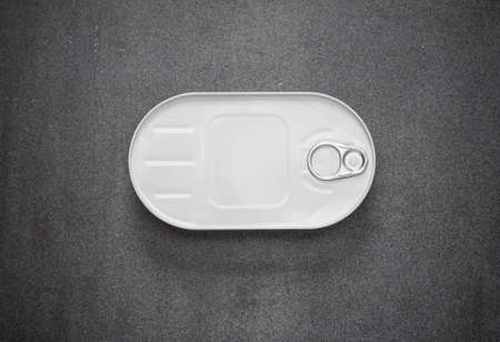 closed canned in a white oval box on a gray background, view from aboveの写真素材