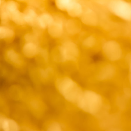 Abstract festive blurred golden background bokeh, square photoの写真素材