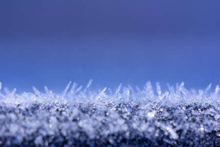 winter background with glittering ice crystals with copy space,  macro photos. shallow depth of fieldの写真素材