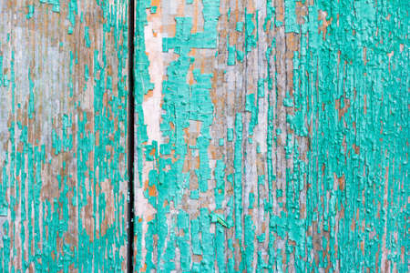 wooden retro background texture with remnants of old green paint with space for textの写真素材