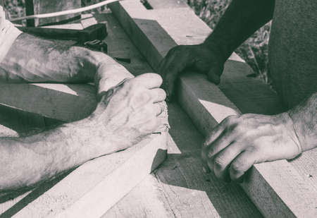 the hands of the workers carpenters, joiners. black and white photoの写真素材