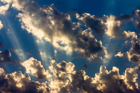 background of sky with clouds and sun rays
