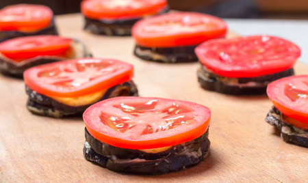 Fried eggplants with fresh tomatoes close upの写真素材