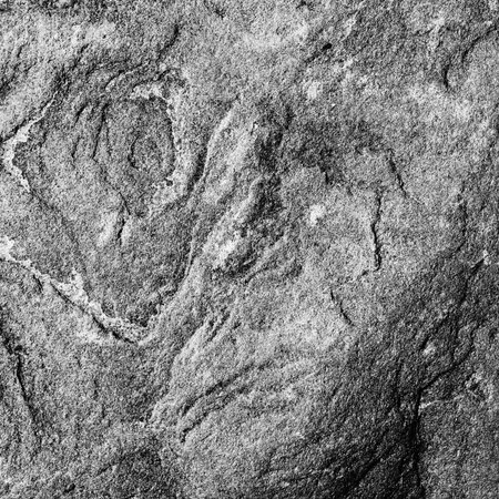Stone texture of the flagstone, black and white monochrome photo