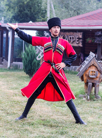 Adygea, Russia - August 19, 2017: the guy Adyg dancing traditional dance Circassian at the festival...
