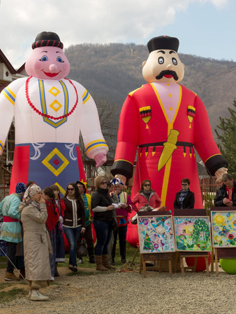 Adygea, Russia - March 12, 2016: large doll inflatable figures depicting man and woman in...