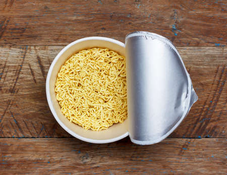 instant noodles on wooden background, top view close-upの写真素材