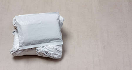 gray mail packages from Chinese stores close-up with copy space, top viewの写真素材