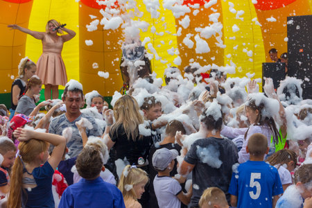 Kamennomostsky, Russia - September 1, 2018: Happy children having fun at a foam party at a holiday town day Kamennomostsky in an autumn parkのeditorial素材