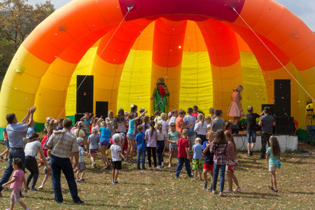 Kamennomostsky, Russia - September 1, 2018: Animators on stage entertain children at the festival day of the village of Kamennomostsky in the autumn parkのeditorial素材