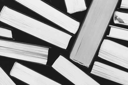 a stack of books a top view of the edge of the pages, a black and white photoの写真素材