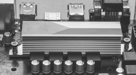 Maykop, Russia - November 9, 2018: part of ASUS motherboard with aluminum radiator chipset close-up,...