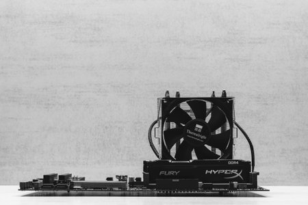Maykop, Russia - November 17, 2018: black DDR 4 DIMM 16 Gb Kingston HyperX Fury Memory RAM Module in the slot on the motherboard Asus and cooler Thermalright closeup, black and white photographyのeditorial素材