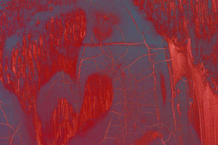 red abstract grunge background texture with paint streaks and cracksの写真素材
