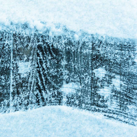 winter background of planks covered with snow with copy spaceの写真素材