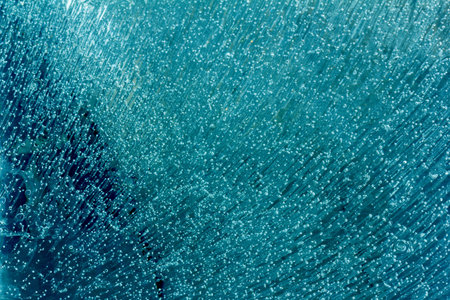 background texture of ice with frozen air bubbles