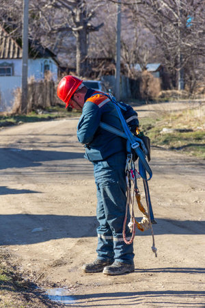Krasnodar, Russia - March 2, 2020: a male electrician checks the equipment for lifting to a heightのeditorial素材