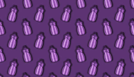 background texture pattern with purple plastic bottles with dishwashing liquid on a purple backgroundの写真素材