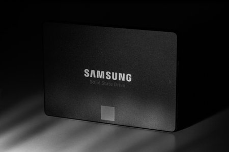 Krasnodar, Russia - November 27, 2020: SSD Samsung 860 EVO 250MB on the gray background closeup with deep shadows, black and white photoのeditorial素材