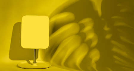 mirror on a yellow background with copy spaceの写真素材