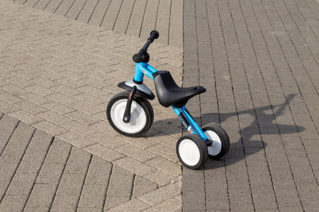 Krasnodar, Russia - September 27, 2021: german balance bike pukymoto on the background of gray paving slabs close-upのeditorial素材