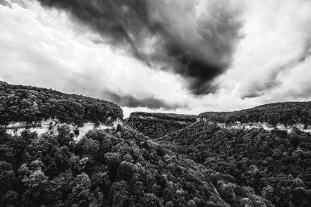 beautiful landscape overlooking the Una - Koz mountain range with dramatic overcast sky black and white photoの写真素材