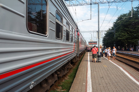 Lazarevskoye, Russia â August 24, 2018: passengers get off the train on the platform of the railway stationのeditorial素材