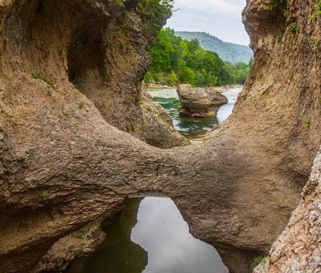 summer landscape with a river in a mountain canyon in the foothills of the Caucasusの写真素材