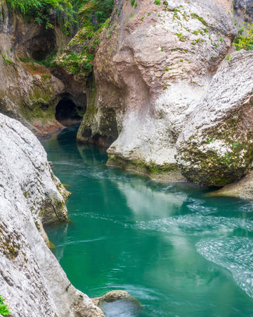 a beautiful landscape with river among rocks in the gorge, shot with a long exposureの写真素材