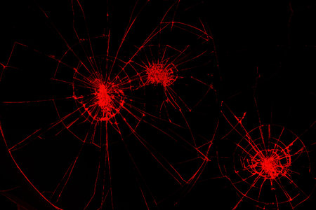 traces of bumps and cracks red color on a broken LCD screen, computer monitor or TV