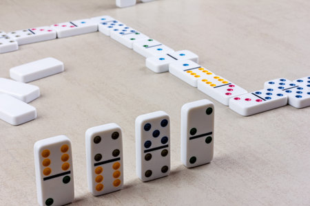 dominoes and a chain of dominoes games on the tableの写真素材