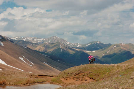 Cyclists travelling in the mountains of Georgia. Beautiful nature. Lifestyleの写真素材