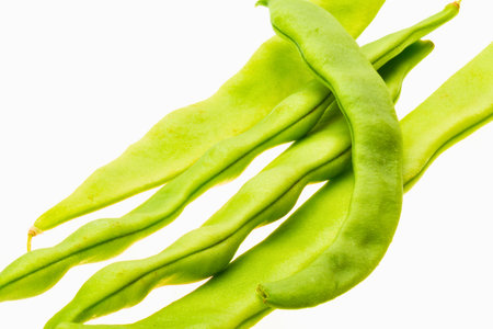 Close-up of vibrant fresh green runner beans, highlighting their natural texture and healthy appearance. Perfect for culinary, dietary, and organic food themes.の写真素材