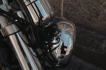 A detailed close-up image of a motorcycle wheel and tire, showcasing the tread pattern and the shiny...