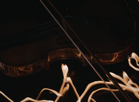 A detailed close-up image of a violin and bow, highlighting the intricate craftsmanship and the...