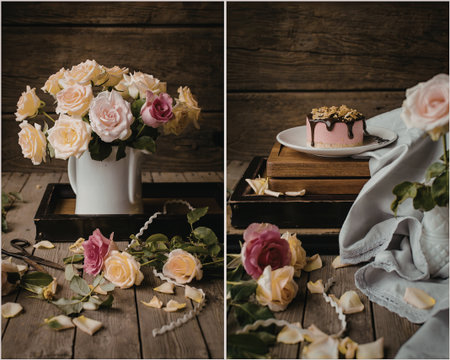 A charming arrangement of colorful roses in a white vase sits beside a beautifully decorated cake on a rustic wooden table. The scene is adorned with scattered rose petals and a delicate cloth, creating a cozy and inviting atmosphere.の写真素材